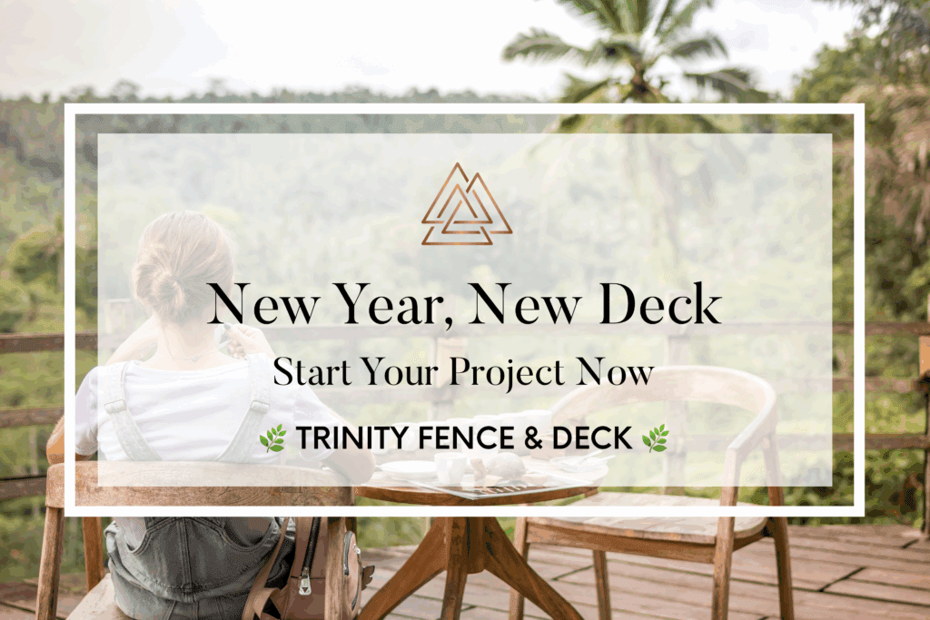 Woman sitting on a backyard deck with a warm beverage at a wooden patio table, surrounded by greenery—ideal setting for a new deck project.