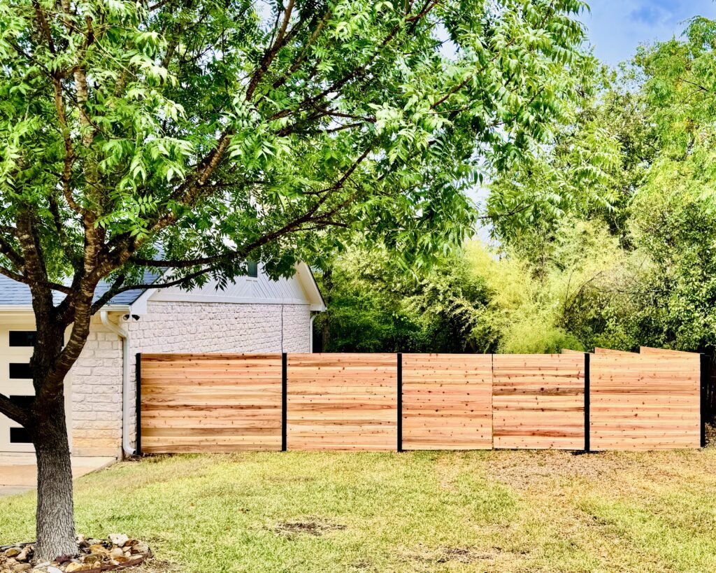 Trinity-built cedar fence between homes in Central Texas