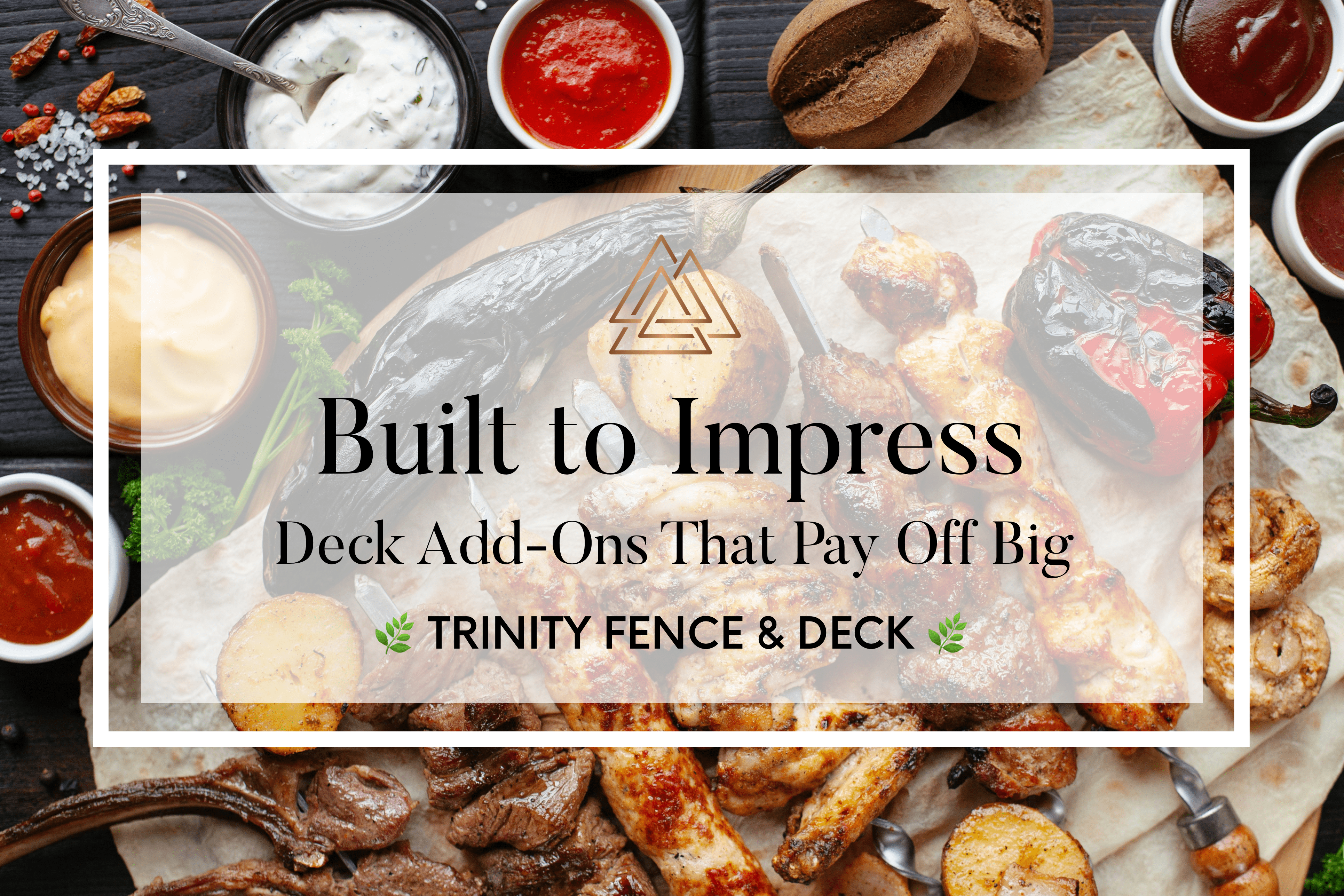 Overhead view of a grilled feast on a backyard deck—highlighting the impact of deck add-ons like outdoor kitchens and hosting spaces. Trinity Fence & Deck promotional overlay.