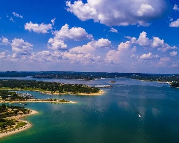 Aerial view of Lakeway, Texas with lake and surrounding homes