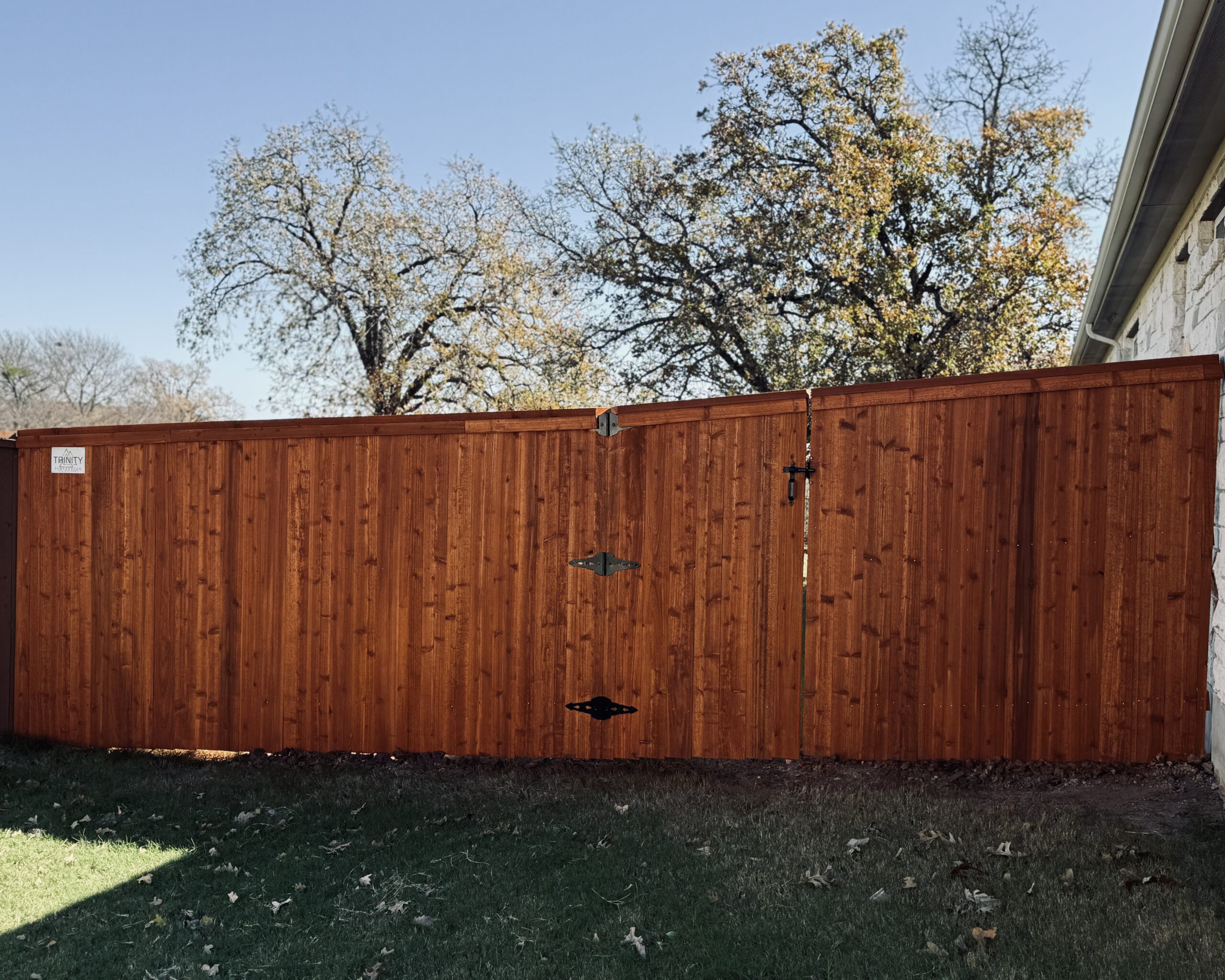 Cedar privacy fence stained with Wood Defender Sierra in Liberty Hill backyard